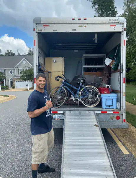 a member of STAR Movers in front of moving truck